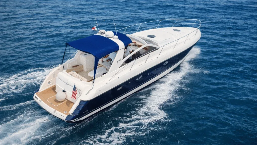 A private yacht underway across calm Caribbean water