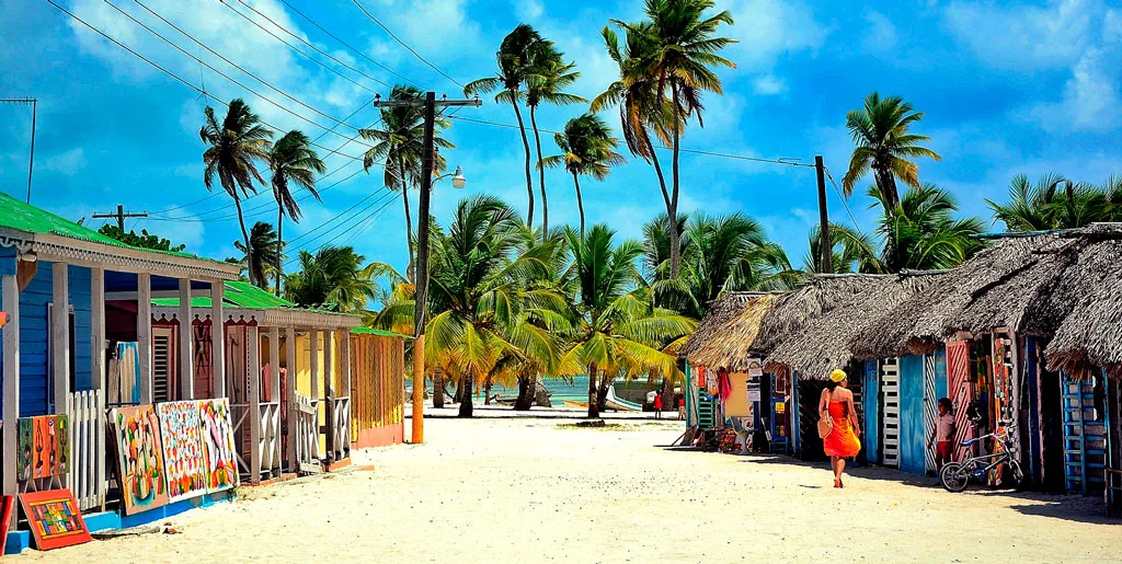 Pastel-painted wooden houses of Mano Juan fishing village on Saona