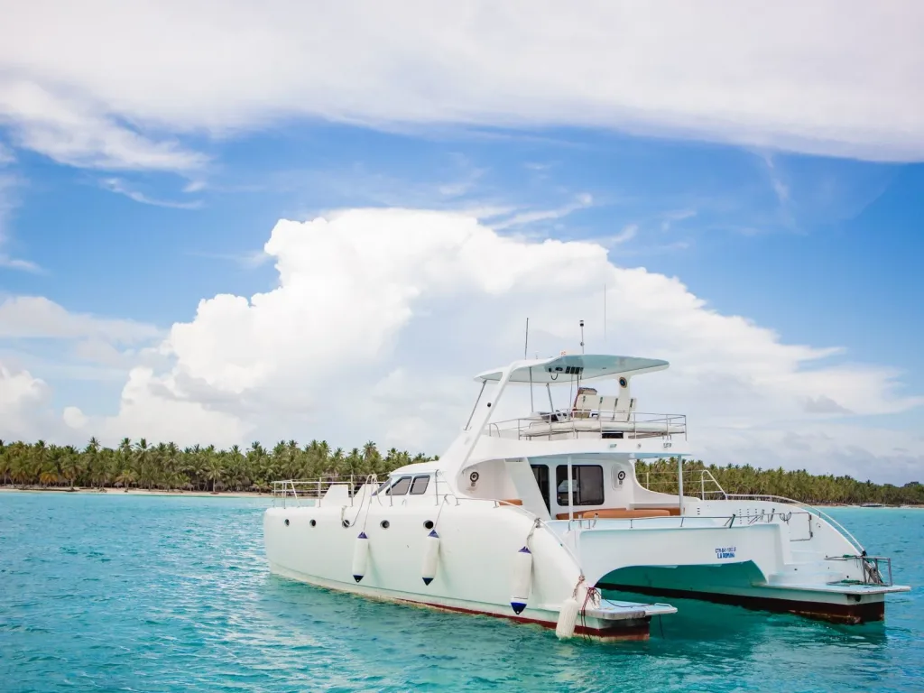 A private yacht anchored in calm turquoise water near Saona Island